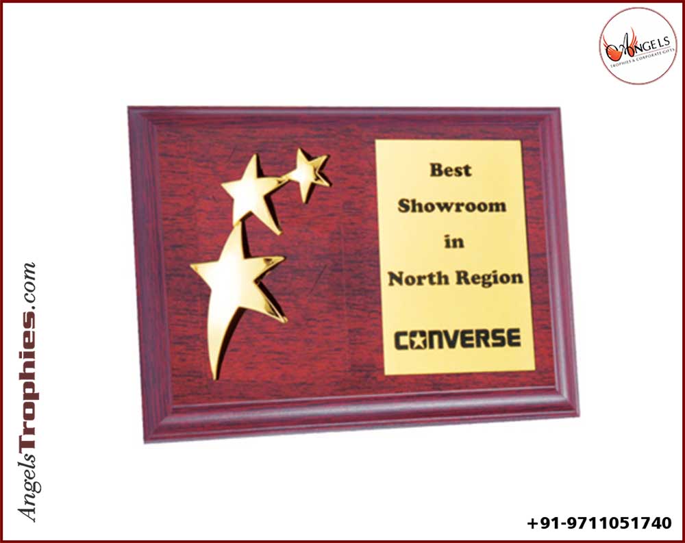 wooden plaque with three golden star with plaque