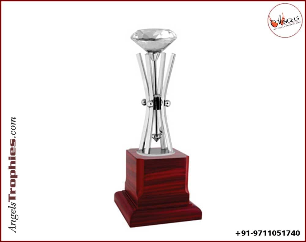 diamond trophy with siver metal pillar with wooden base