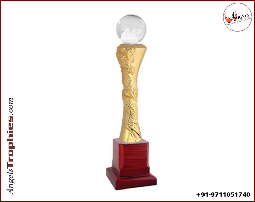globe metal award with wooden base