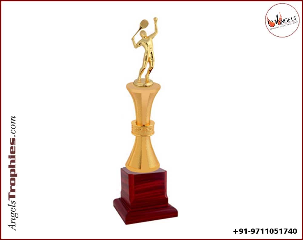 Sports trophy with table tennis man with golden man with wooden base