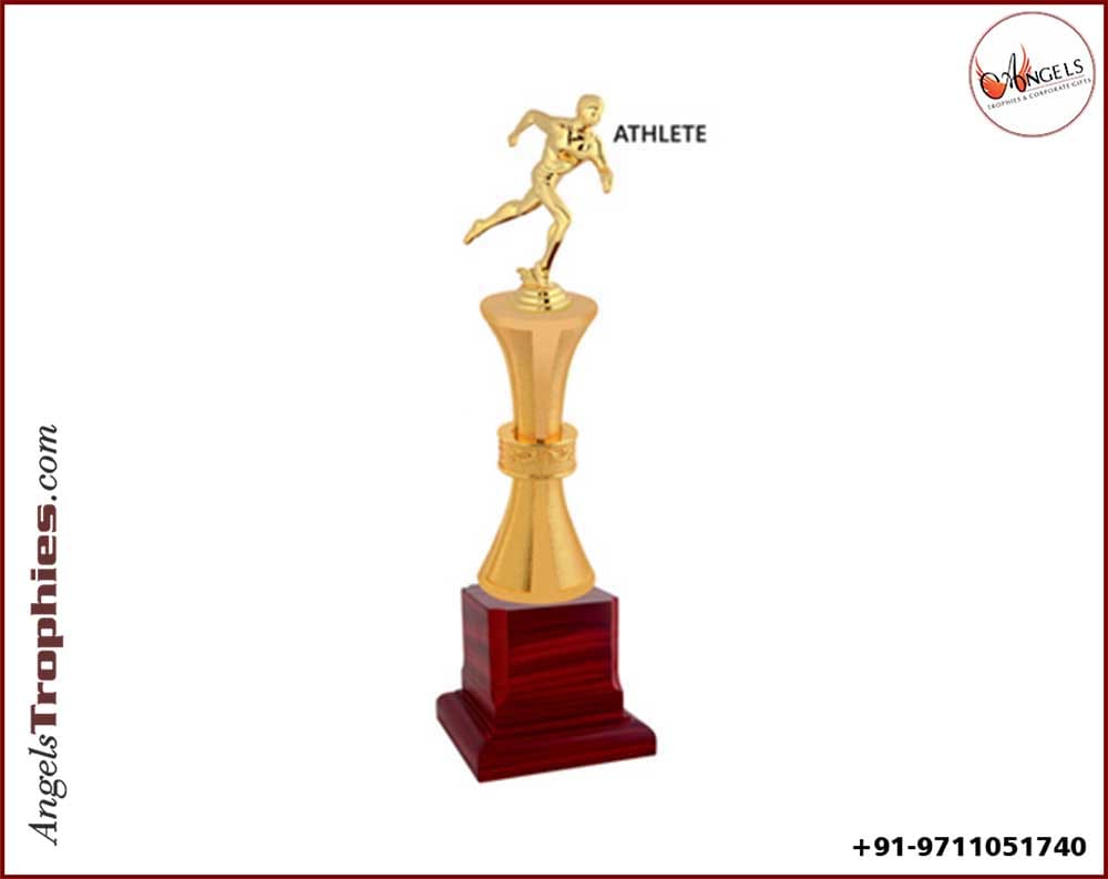 metal athlete sports trophy with wooden base