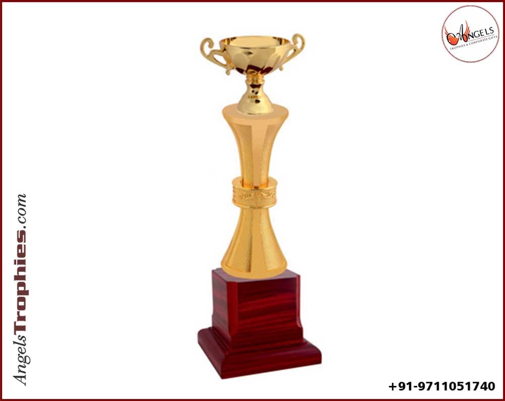 metal cup golden award trophy with wooden base