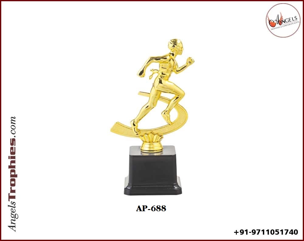 Fibre Plastic golden running man with black plastic base