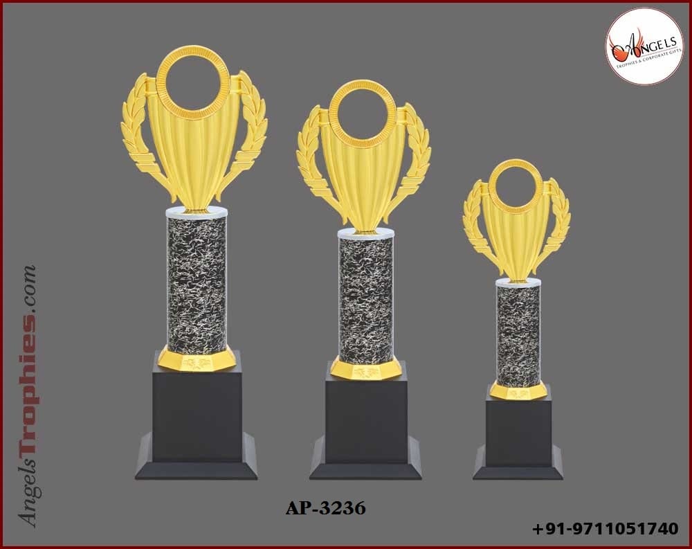 Metal Pillor with golden top with wooden black base