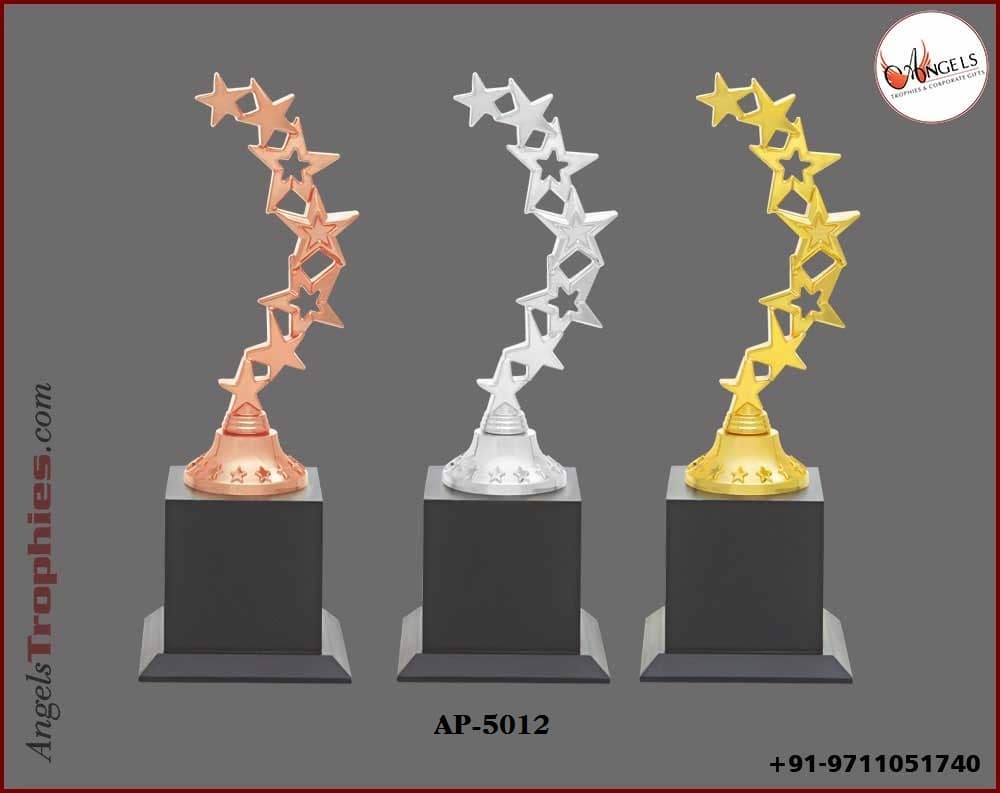 metal zig zag golden silver bronze star with wooden base