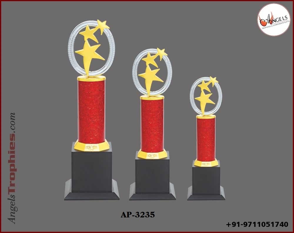 metal red pillor with golden three star with wooden base