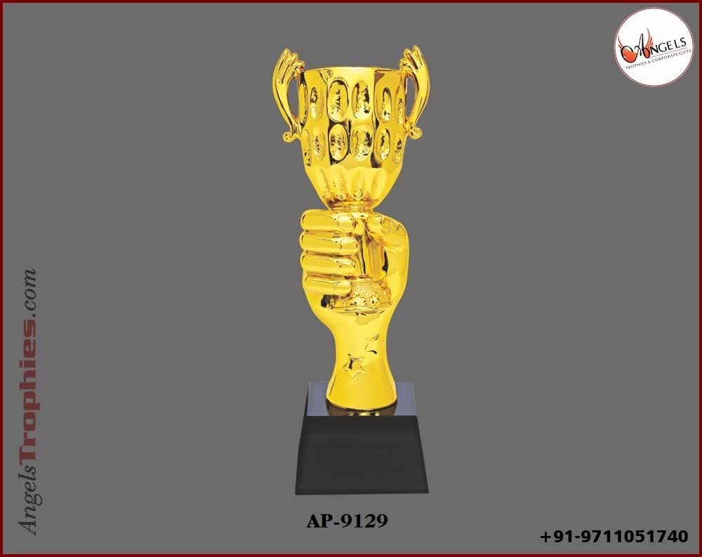 Metal golden hand with handle golden cup with black base