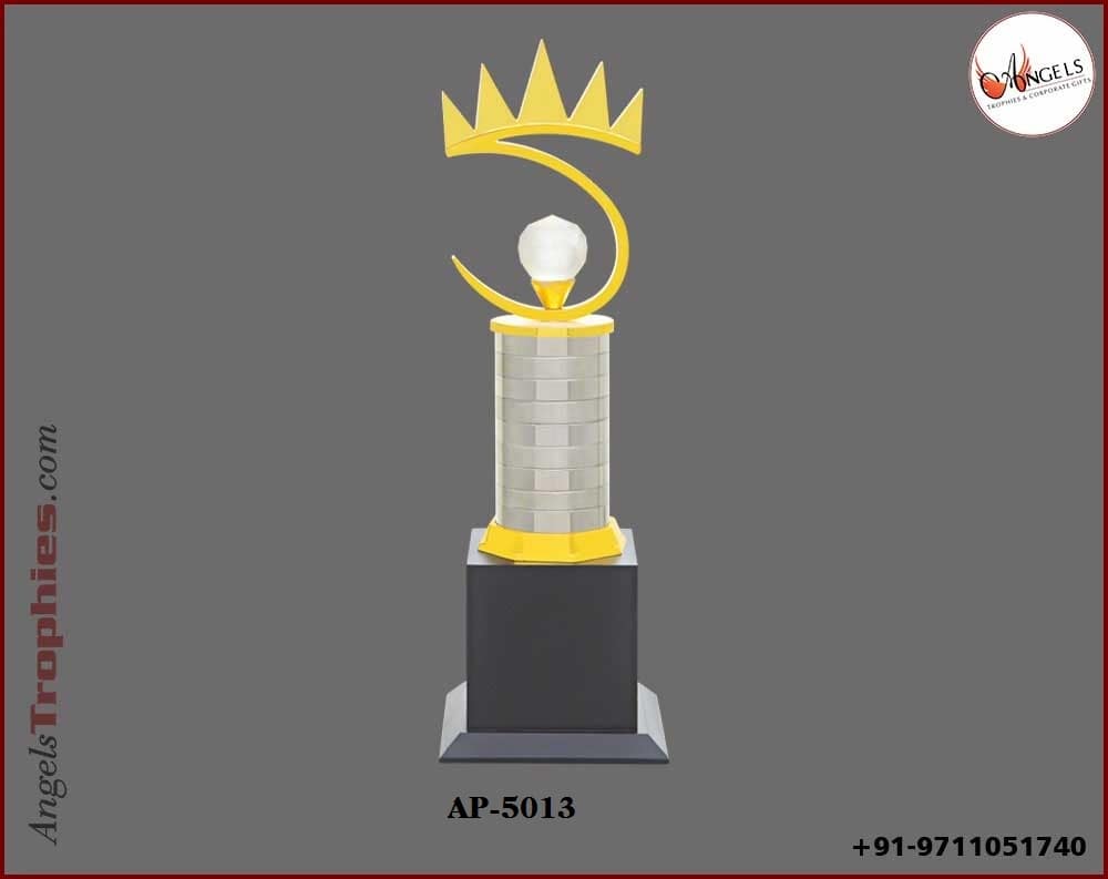 Metal pillor with diamond with golden king crown with wooden black base