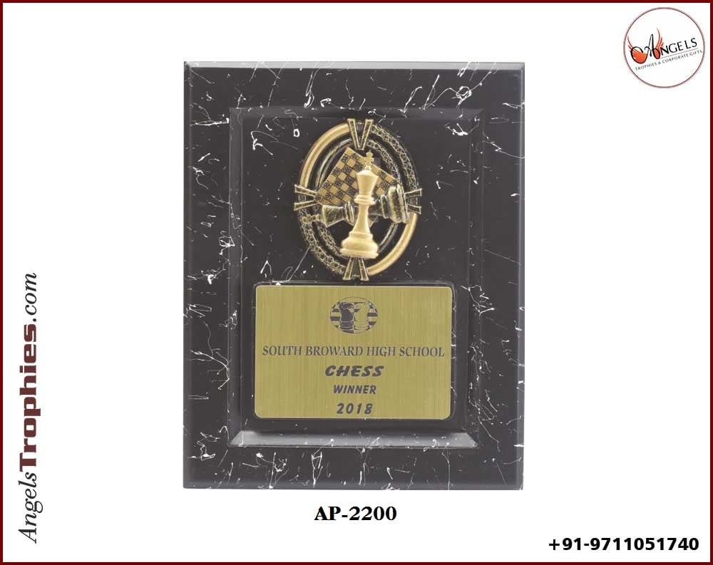 black wooden sheild award with chess accessories