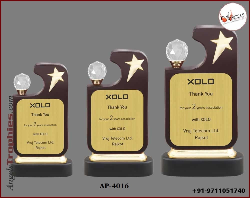 wooden award trophy with metal star with diamond with wooden base