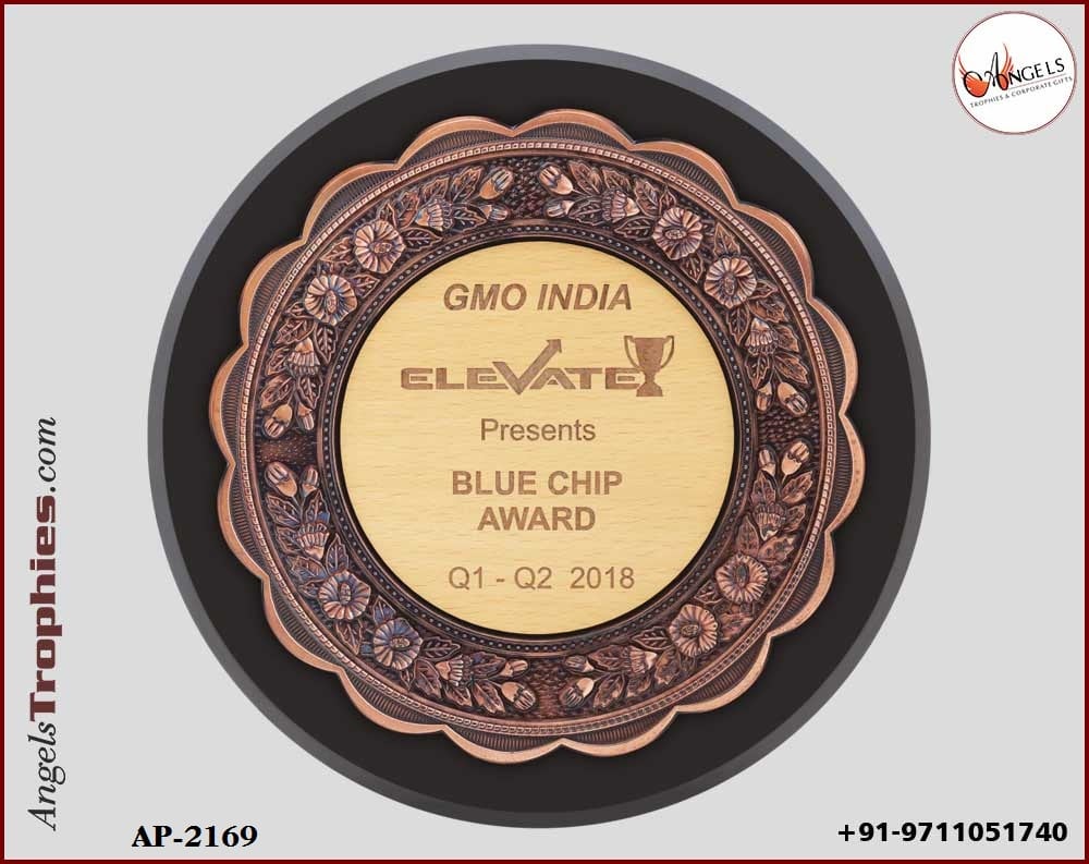 shiled wooden plaque with bronze frame