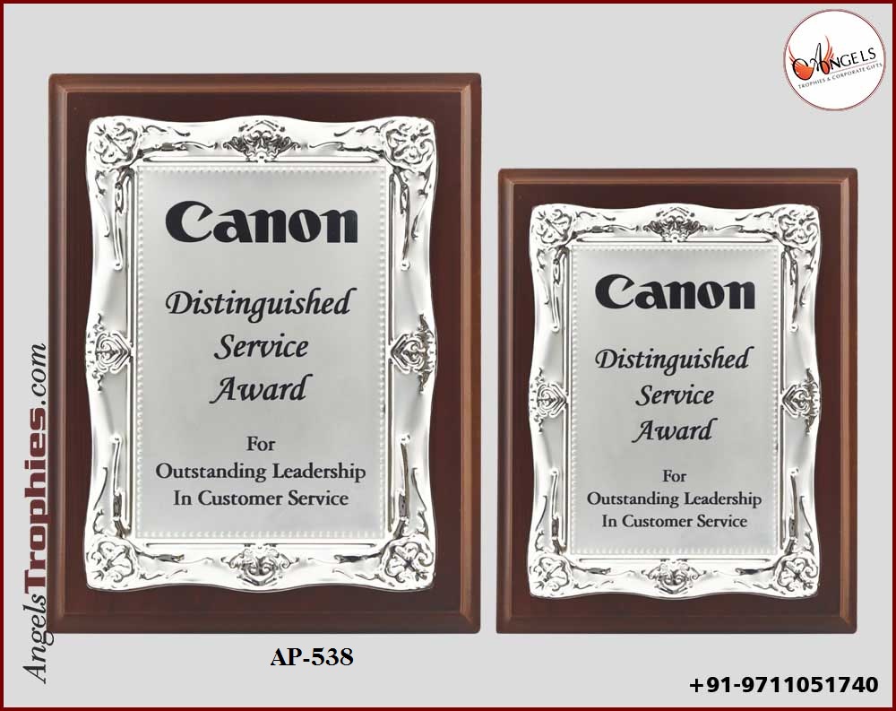 wooden award plaque with metal silver frame