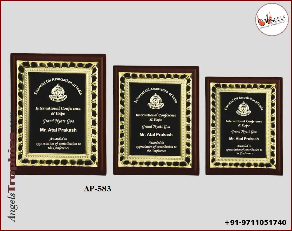 wooden award plaque with metal golden frame with wooden