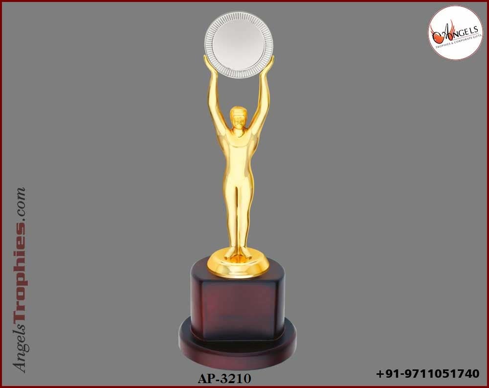 metal golden man with handle silver round with wooden base