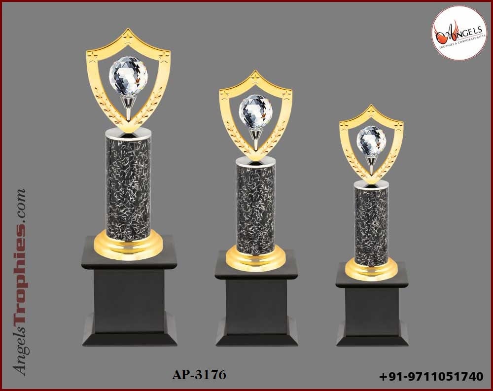 metal trophy award with crystal ball