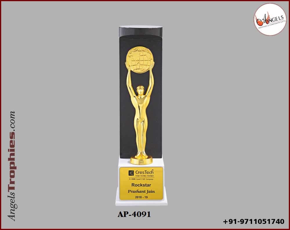 wooden trophy with standing metal man with handle metal globe with white wooden base