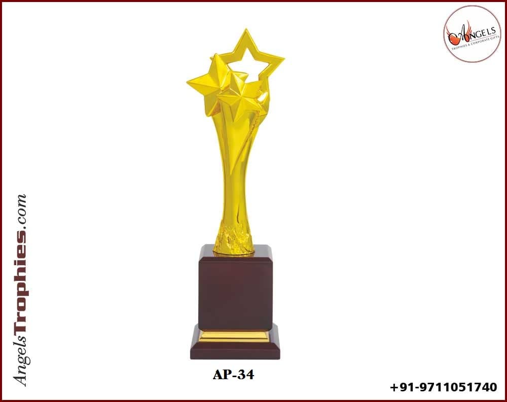metal golden heavy star with wooden base