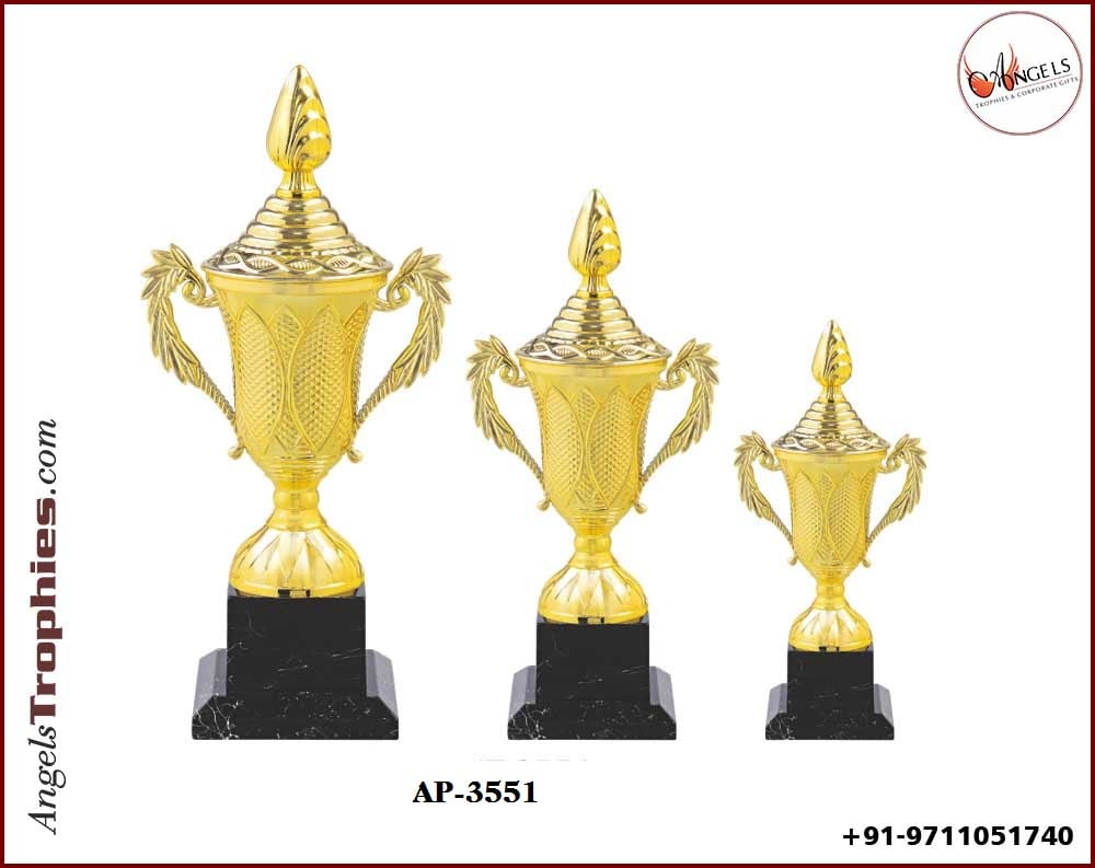 plastic golden cup with black base