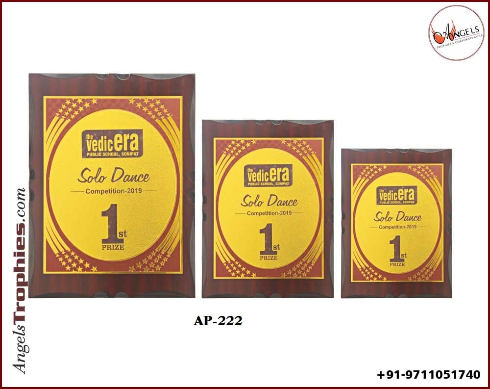 wooden award shield with golden foil