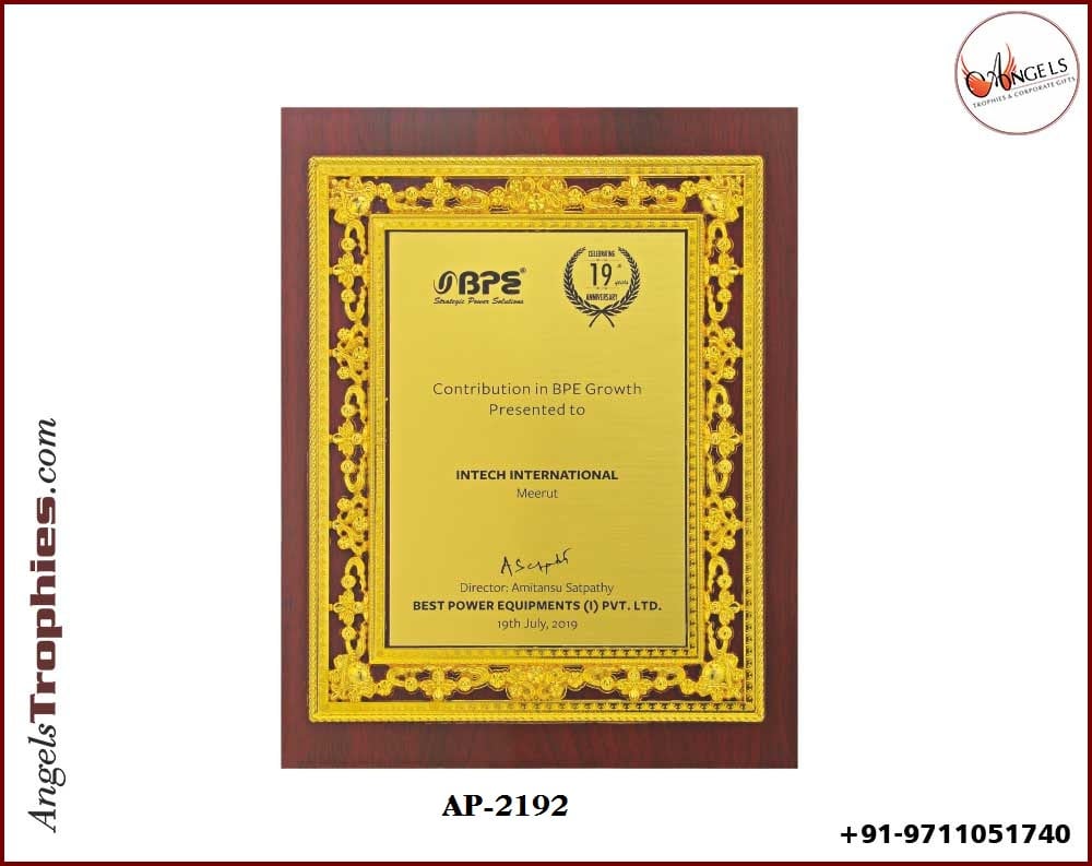wooden shield award with metal golden frame
