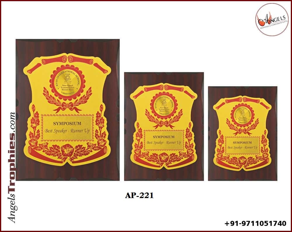 wooden award shield with golden foil