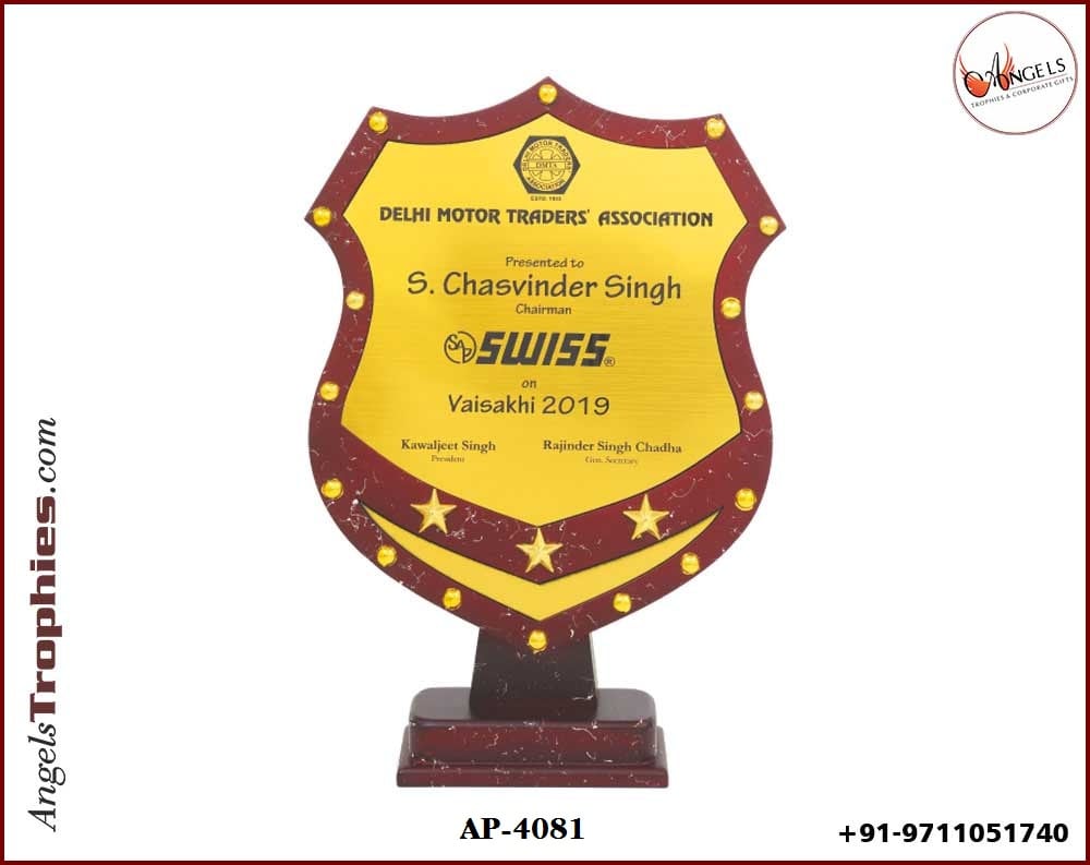 wooden award trophy with wooden base with metal star and plate