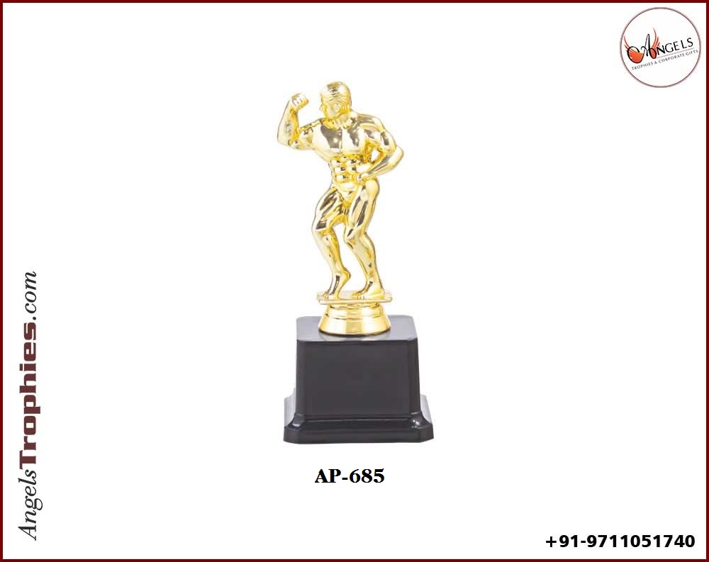 Fibre plastic Wrestler golden man with black base